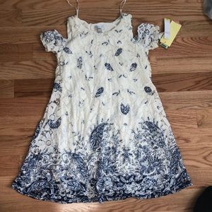 Off the shoulder blue patterned dress.